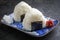 Traditional Japanese onigiri offered with umeboshi on a modern design bowl