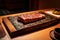 traditional japanese restaurant, with wagyu steak and raw fish on the menu