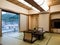 Traditional Japanese style room with tatami floor mats in Aburaya Ryokan