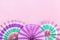 Traditional Japaneses festival paper fan with pink, turquoise, white stripes Birthday party, celebration holidays concept Abstract