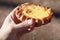 Traditional Karelian pie with rice filling in male hand