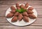 Traditional kebbe and pita bread on big round plate in lebanese restaurant