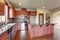 Traditional kitchen with dark hardwood floor.