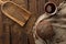 Traditional kvass beer mug with rye bread on rustic style wooden table.