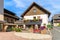 Traditional l alpine houses decorated with flowers on shore of Weissensee lake in summer season, Carinthia land, Austria