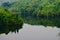 Traditional lake water with green trees around a place