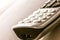 Traditional landline phone isolated on wooden desk background