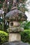 A traditional lantern made of stone with cherry blossom