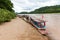 Traditional laotian boats on the bank of Mekong River,