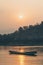 Traditional Laotian wooden slow boat on Mekong river near Luang Prabang, Laos