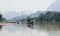 Traditional Laotian wooden slow boat on Nam Ou river near Nong Khiaw village, Laos