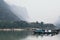 Traditional Laotian wooden slow boat on Nam Ou river near Nong Khiaw village, Laos