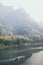 Traditional Laotian wooden slow boat on Nam Ou river near Nong Khiaw village, Laos