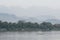 Traditional Laotian wooden slow boats on Mekong river near Luang Prabang, Laos