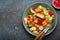 Traditional Levant dish Fattoush salad, Arab cuisine, with pita bread croutons, vegetables, herbs. Healthy Middle