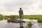 Traditional local man in mokoro boat on river through okavango delta near maun, botswana, africa.