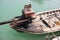 Traditional longtail boat on the sea of green