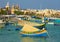 Traditional Luzzu boats at Marsaxlokk market - Malta