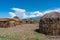 Traditional Maasai Village with Clay Round Huts in Engare Sero area near Lake Natron and Ol Doinyo Lengai volcano in