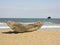 Traditional malagasy boat - canoe on african beach