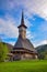 Traditional Maramures neo gothic wooden church in Barsana monastery, Romania