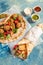 Traditional Mediterranean Arabic grilled halloumi and falafel, hummus and vegetables in flatbread wraps with herbs and sauces