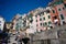 Traditional Mediterranean Italian residential buildings with weathered colorful facades