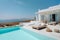 Traditional mediterranean white house with pool on hill with stunning sea view. Summer vacation background. Created with