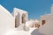 Traditional mediterranean white house. Summer architectural background with blue sky. Created with generative Ai