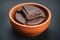 Traditional mexican chocolate bar in wooden bowl