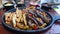 Traditional mexican fajitas on dark sizzling background