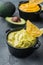 Traditional mexican homemade guacamole sauce, on gray background