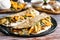 Traditional mexican quesadillas with squash blossom, melted oaxaca cheese, pork rind chicharrÃ³n and mushrooms in Mexico City