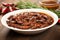 Traditional mexican rosemary with mole sauce and dried shrimps also called \\\