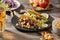 Traditional mexican taco with chicken and vegetables on wooden table. Latin american food