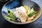 Traditional modern style Japanese fried skrei cod fish filet with bok choi and rice in a design bowl