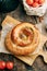 Traditional Moldovan and Romanian cake in the shape of a snail. Swirling round pie close-up