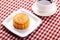 Traditional mooncakes on table setting with cup.