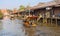 The traditional motorboat and riverside Thai village