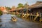 The traditional motorboat and riverside Thai village