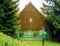 Traditional mountain chalet, brown and green front