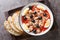 Traditional Murcian Salad Mojete made of tomato, canned tuna, black olive, boiled egg and onion closeup on the plate. Horizontal