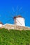 Traditional Mykonos windmill against a blue sky