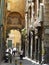 Traditional narrow street with a religious painting over an arc to Naples in Italy.