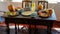 Traditional natural healthy food ona simple table made of old boards, retro furniture, chairs, pillows, home furnishings on the