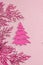 Traditional New Year composition in pink color tones. Festive decor, rosy Christmas tree branch