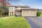 Traditional Northwest house with driveway.