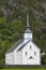 Traditional norwegian white stave church. Valldal Sylte stavkyrkje. Travel Norway.