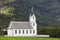 Traditional norwegian white wooden church. Fortun village. Travel Norway.