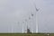 Traditional old dutch windmill goliath and wind turbines near eemshaven in the northern province groningen of the netherlands